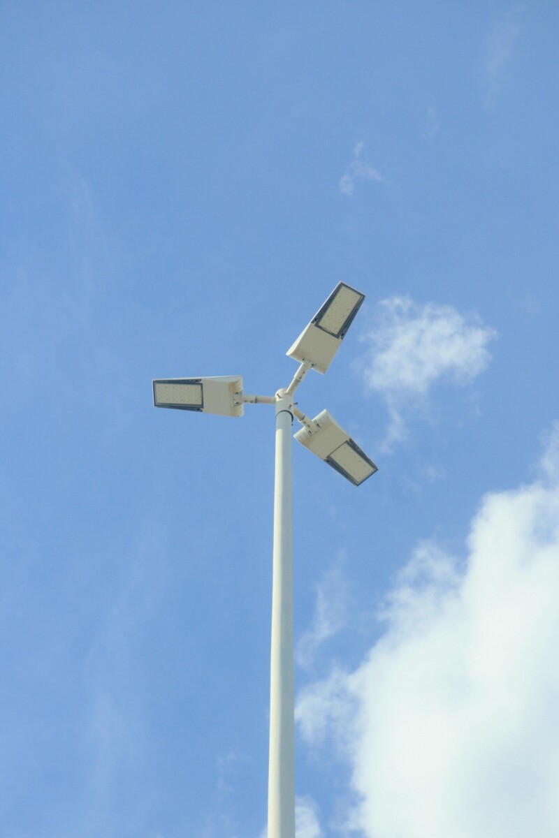 pexels photo 28860098 28860098 Minimalist view of solar street lamp against a bright blue sky with scattered clouds.
