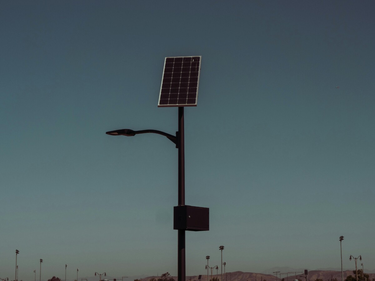 pexels photo 9799703 9799703 Street light with solar panel against a dusky sky, symbolizing renewable energy.
